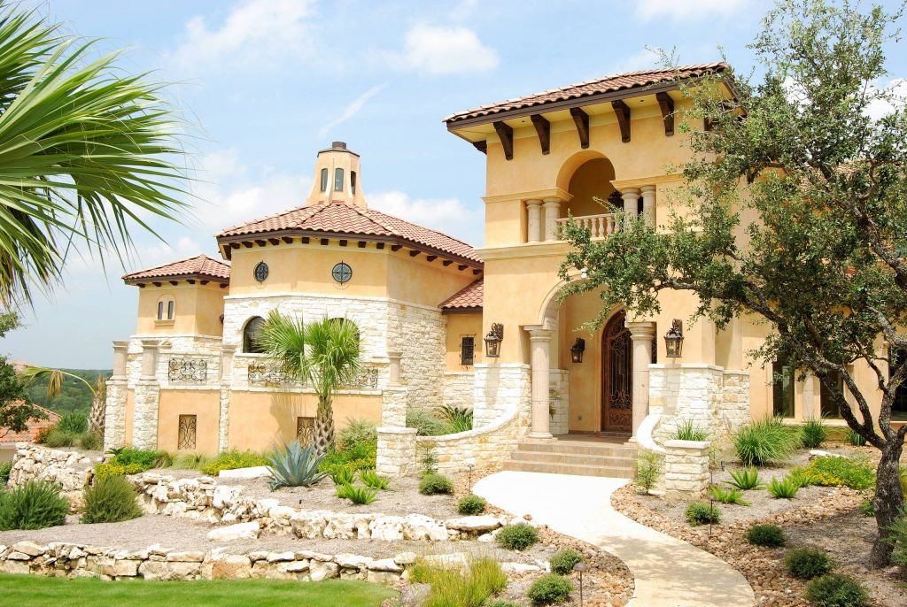 Elegant Mediterranean yellow brick House Exteriors