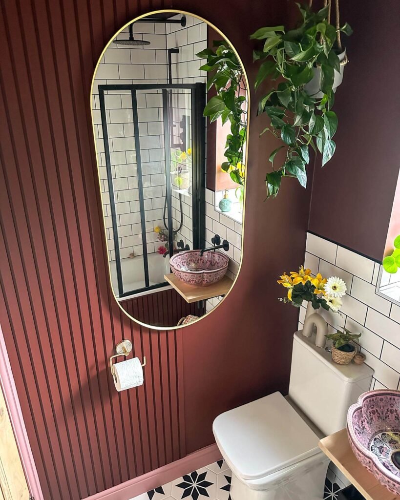 1. Bold Walls and Statement Sink for a Boutique Feel
