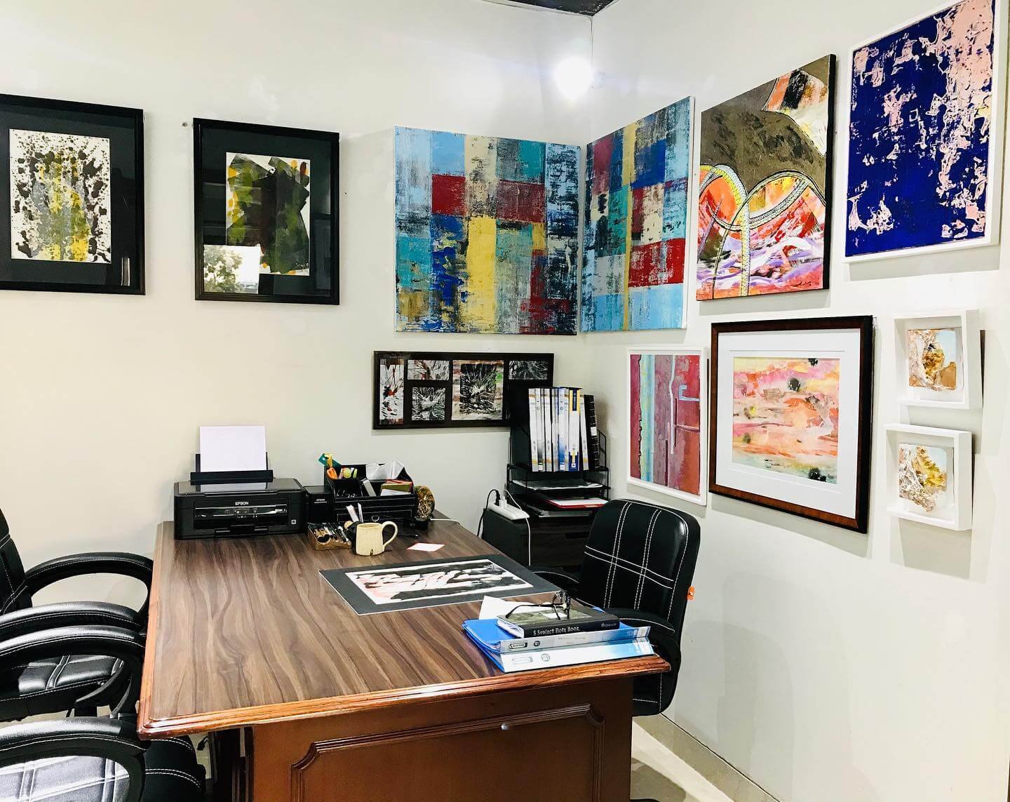 Rustic Charm with Mixed Materials and Vintage Flair Office Gallery Wall