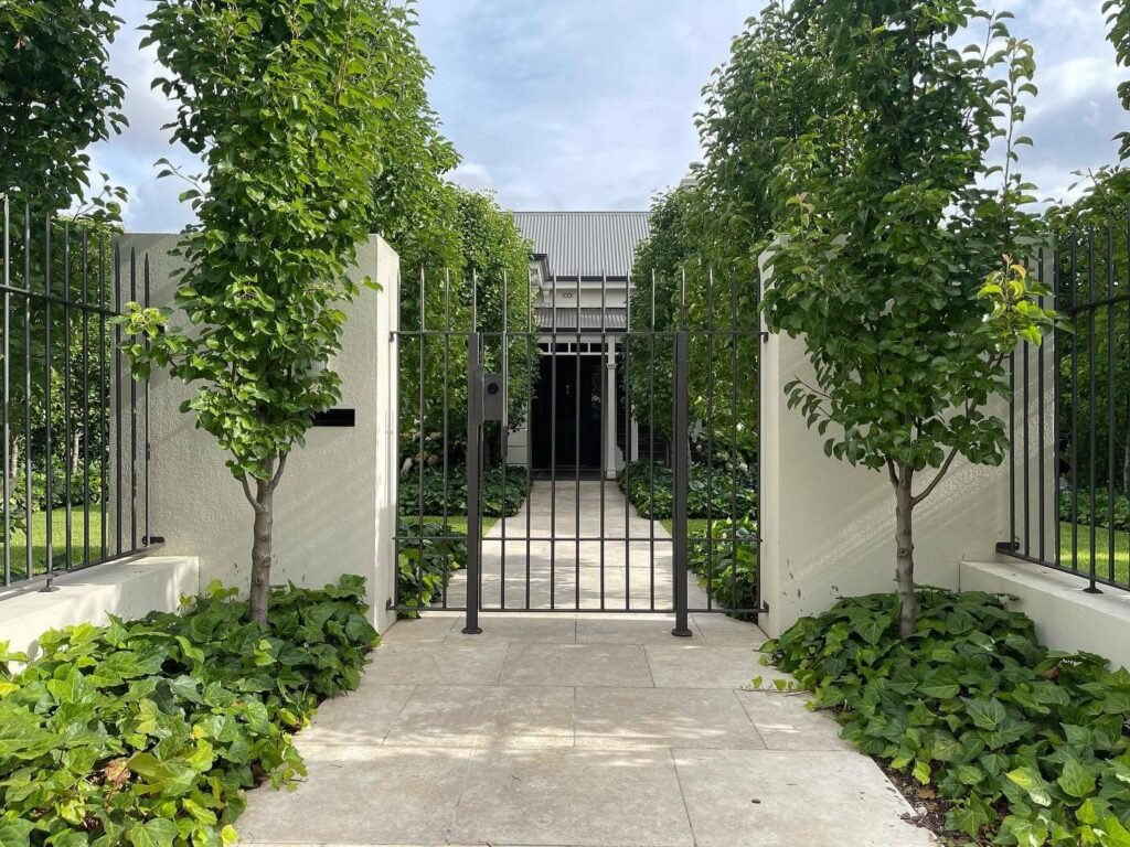 12. Symmetrical Grandeur Behind Wrought Iron Gates