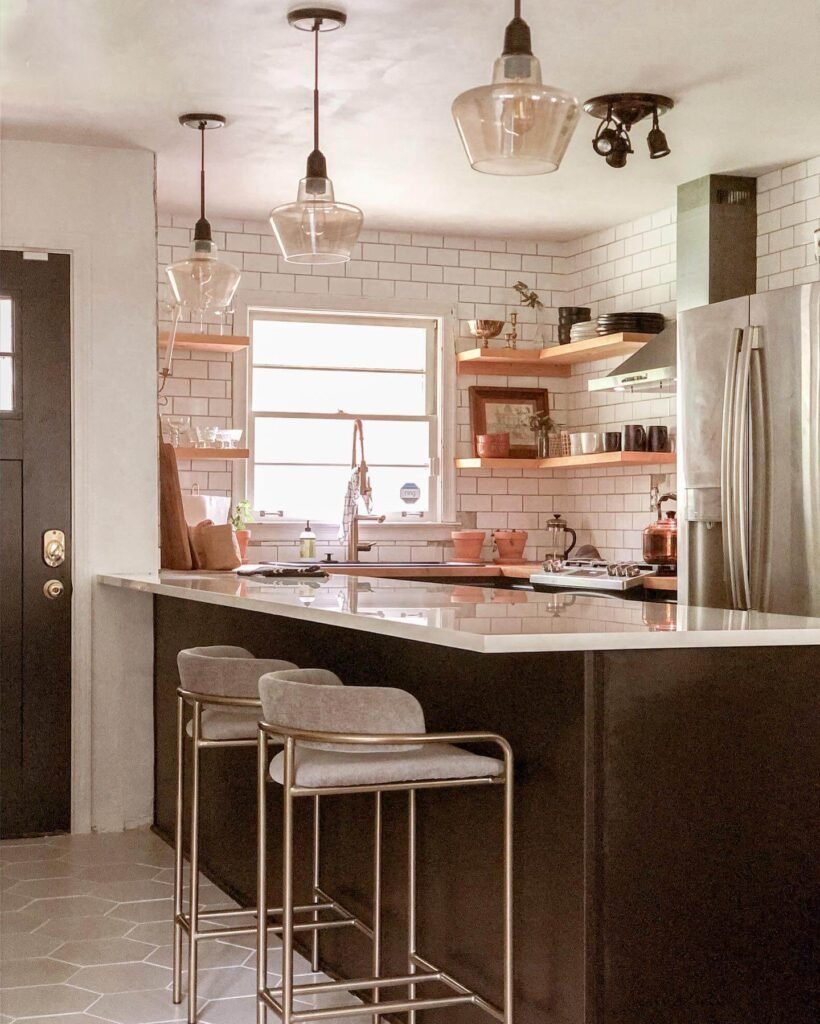 13. Balanced Contrast: Terracotta Flooring and Patterned Tile Backsplash