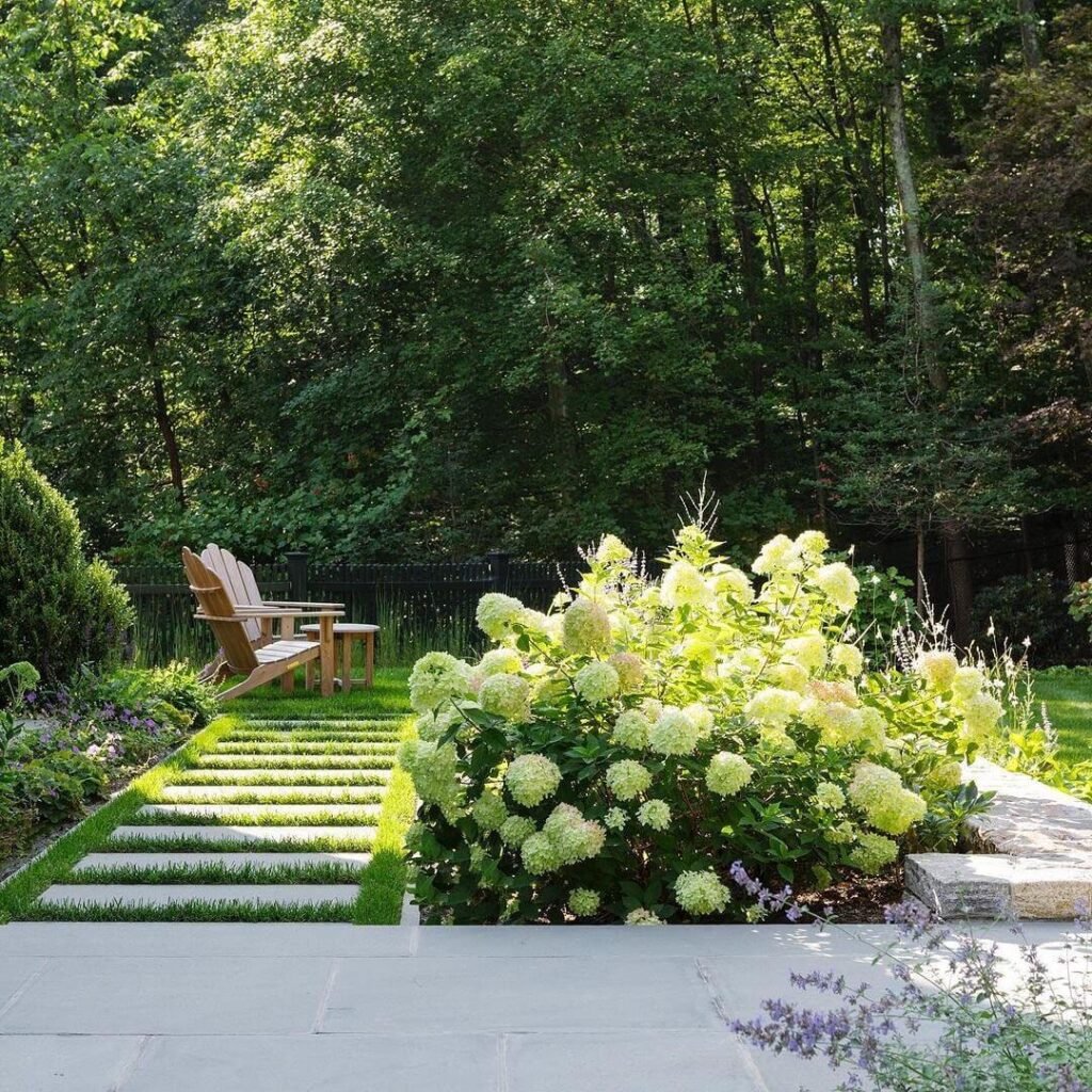 13. Minimalist Stepping Stone Path with Lawn Inlays