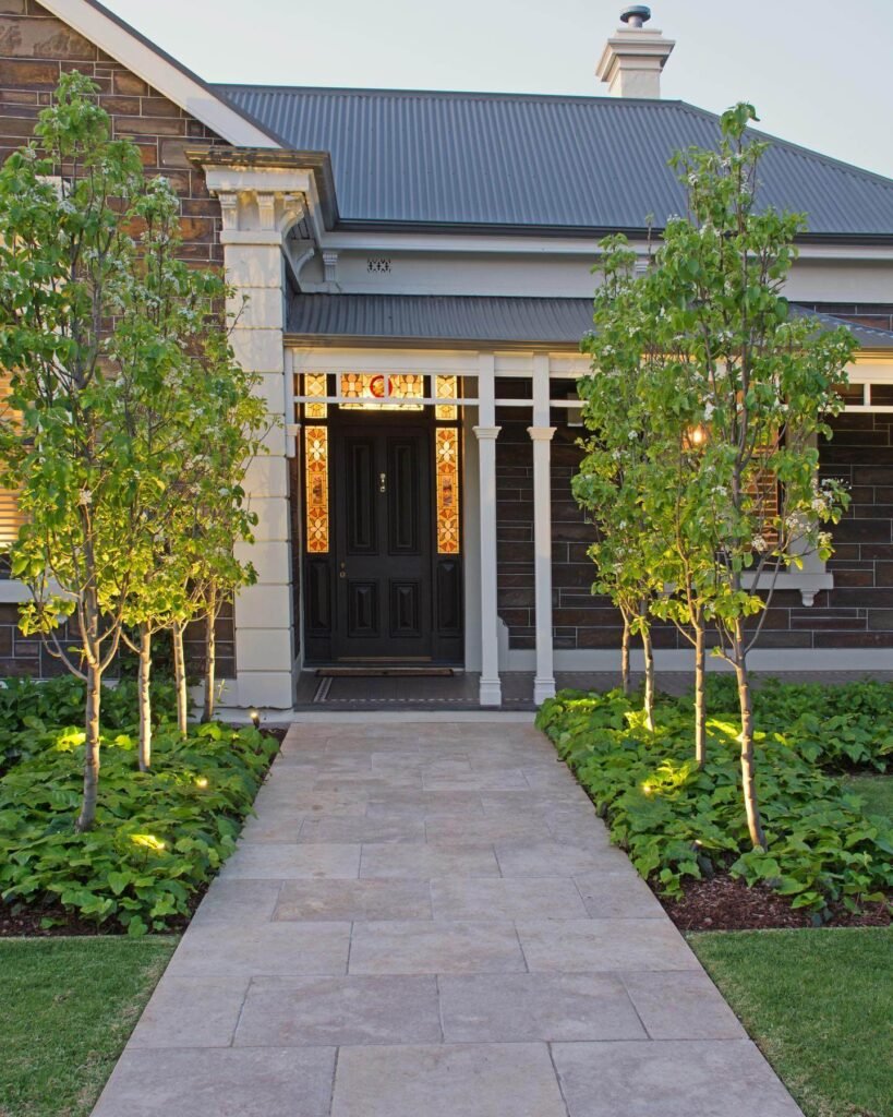 15. Elegant Simplicity with Evening Uplighting