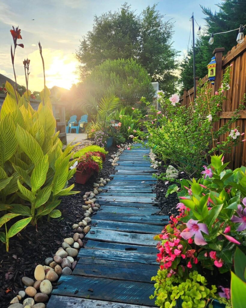 16. Whimsical Wooden Plank Path Through a Tropical Garden