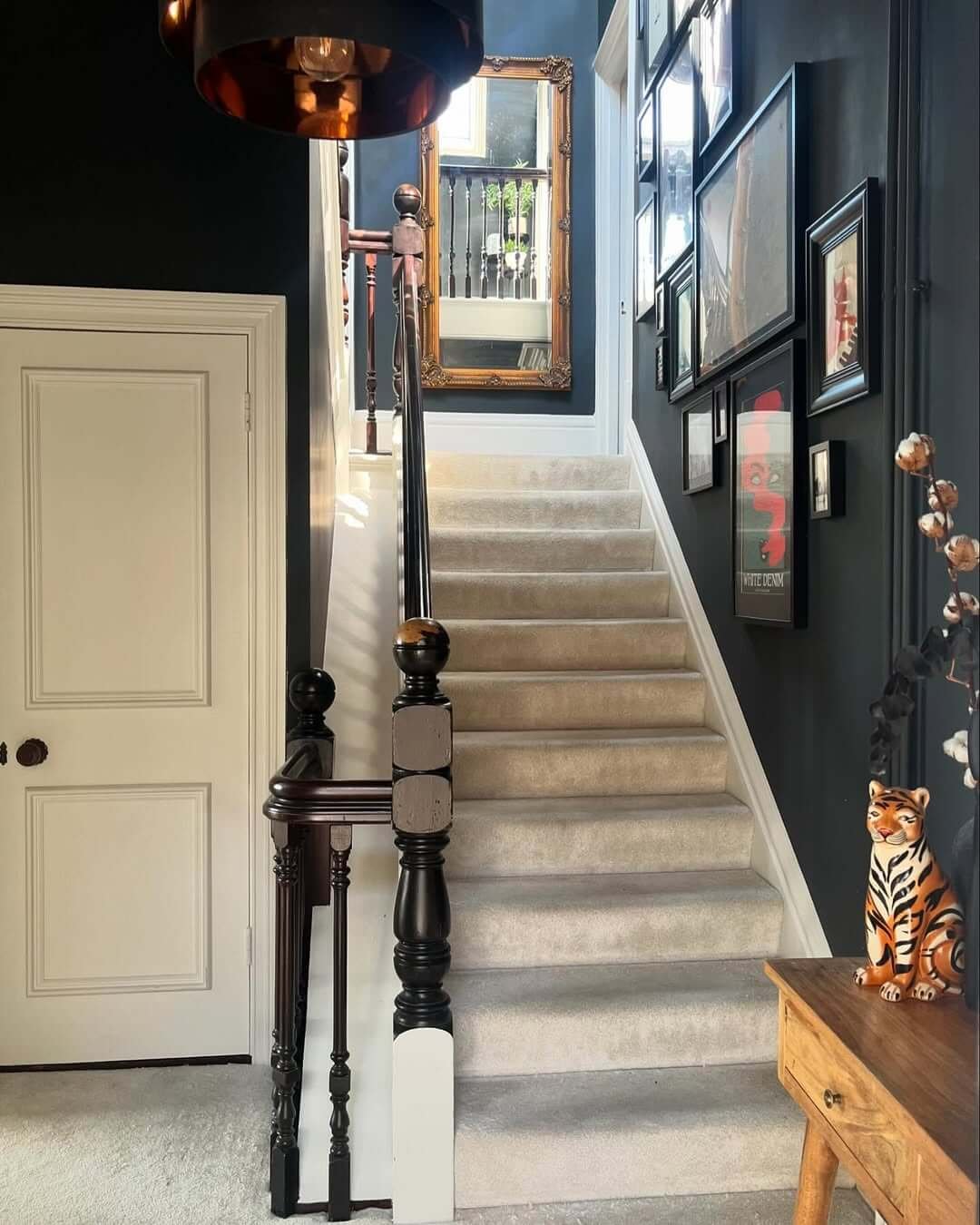 Dark Gallery with Black and White Accents in Hallway Gallery Wall
