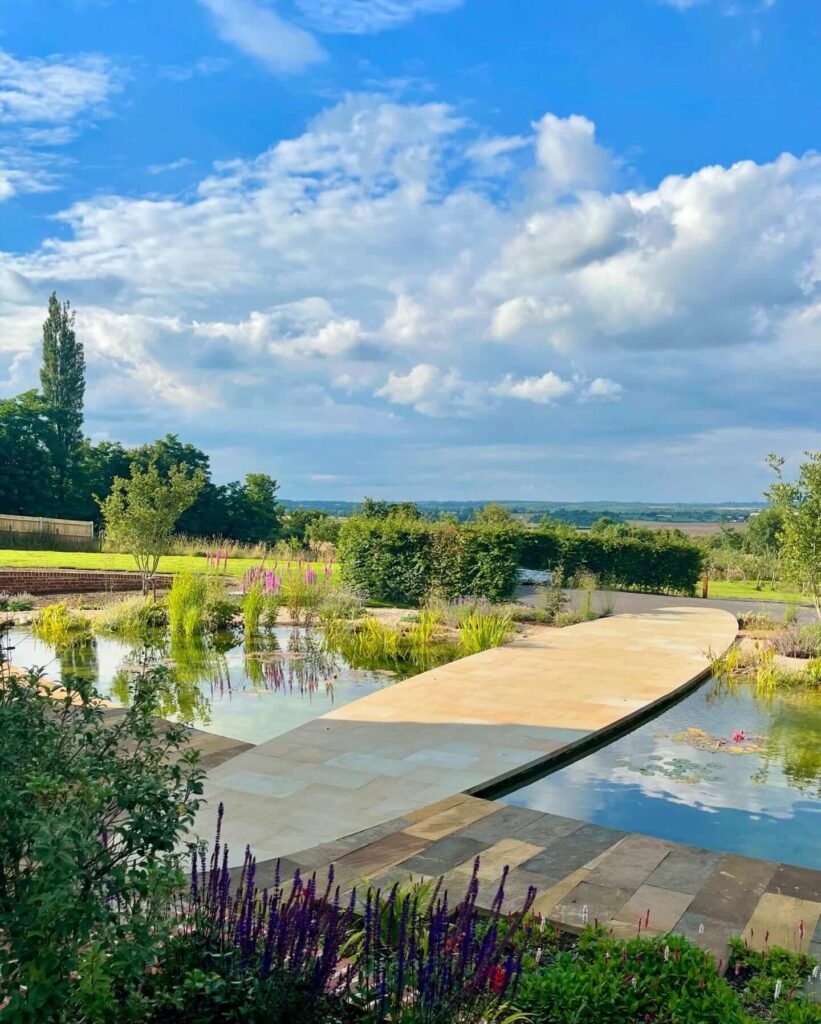 21. Floating Stone Walkway Across a Reflective Pond