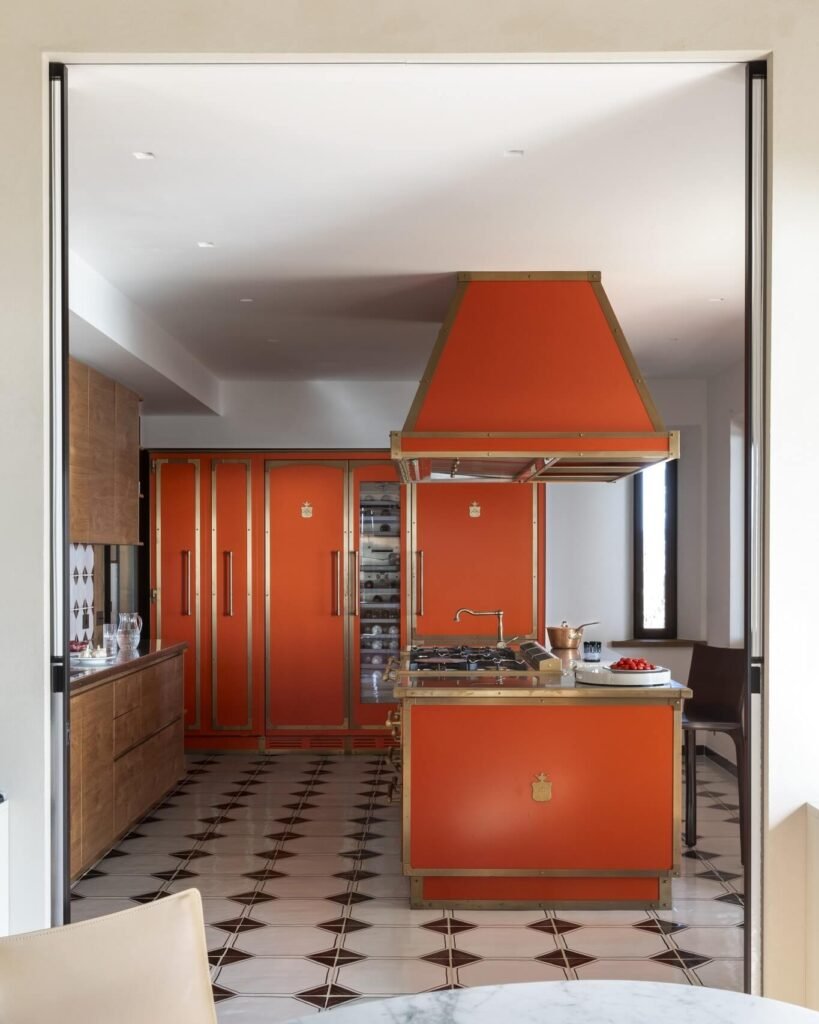 8. Playful Retro: Orange Cabinets and Pop Art Vibes