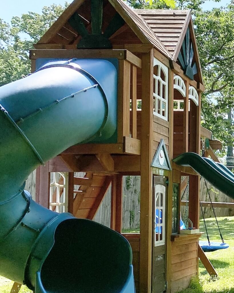 9. Multi Use Wooden Playhouses with Slide Systems