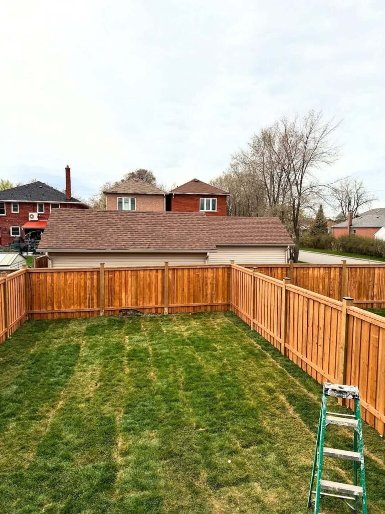 9. Uniform Framed Fence with Golden-Toned Panels