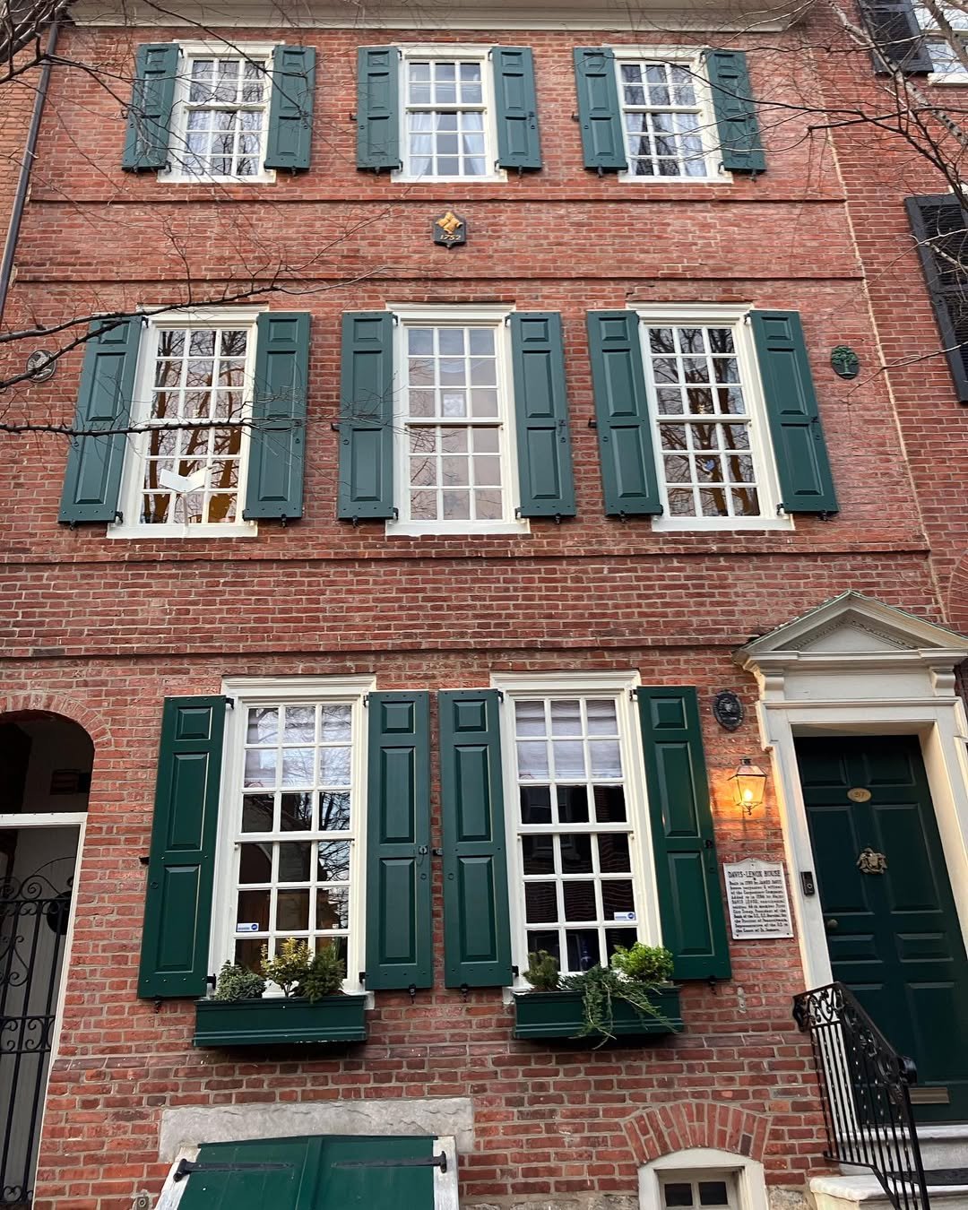 Green Shutters and Door Tan Brick House Exterior