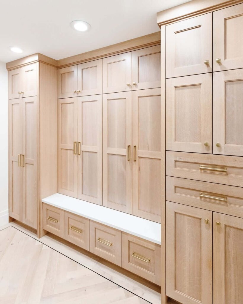 1. Light Wood Cabinets with Gold Hardware and Built in Bench