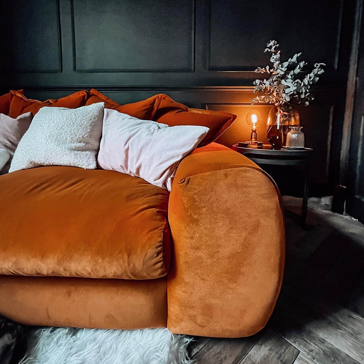 Dark Walls and Warm Velvet Sofa for Moody Living Room