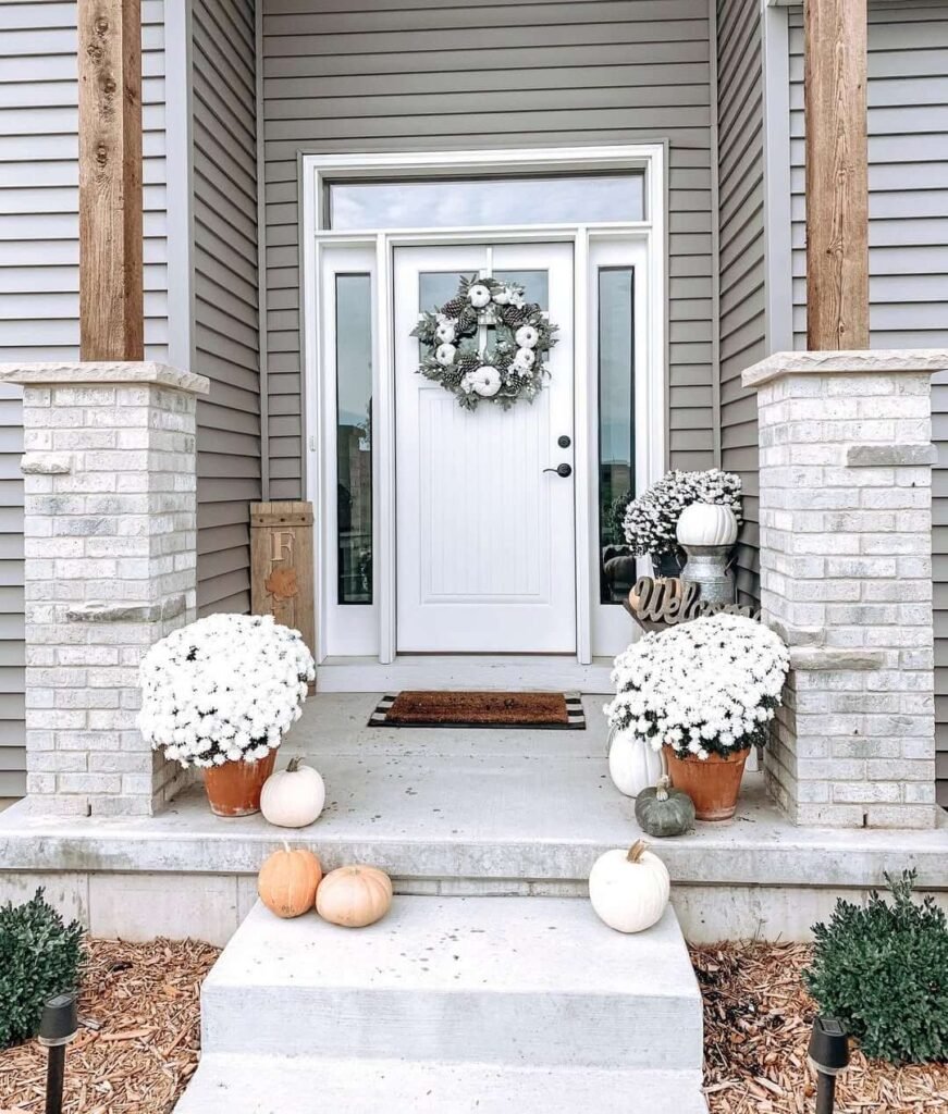 23. Soft and Serene Fall Decor in White and Sage