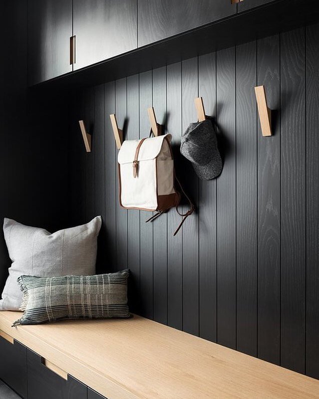 Dark Walls with Wooden Accents Mid-Century Modern Mudroom