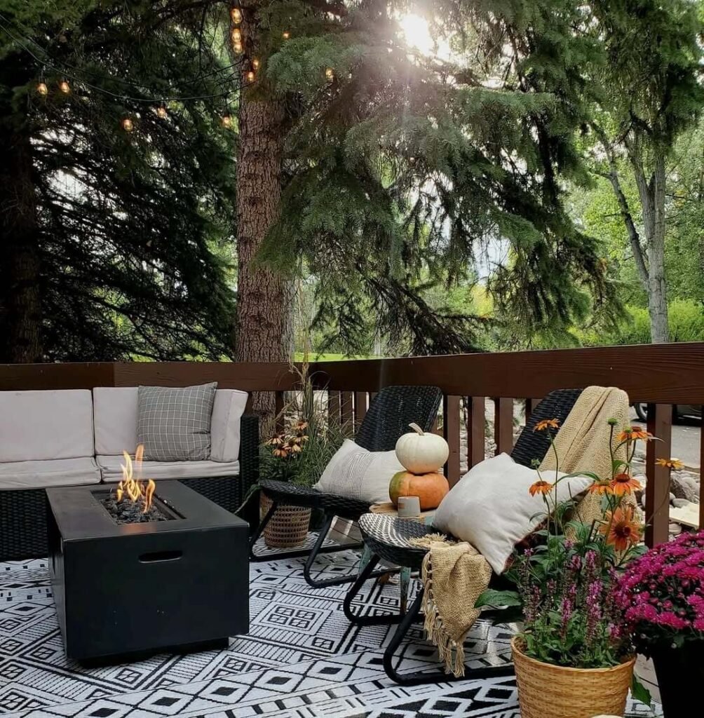 5. Cozy Outdoor Lounge with Fire Pit and Woodland Vibes