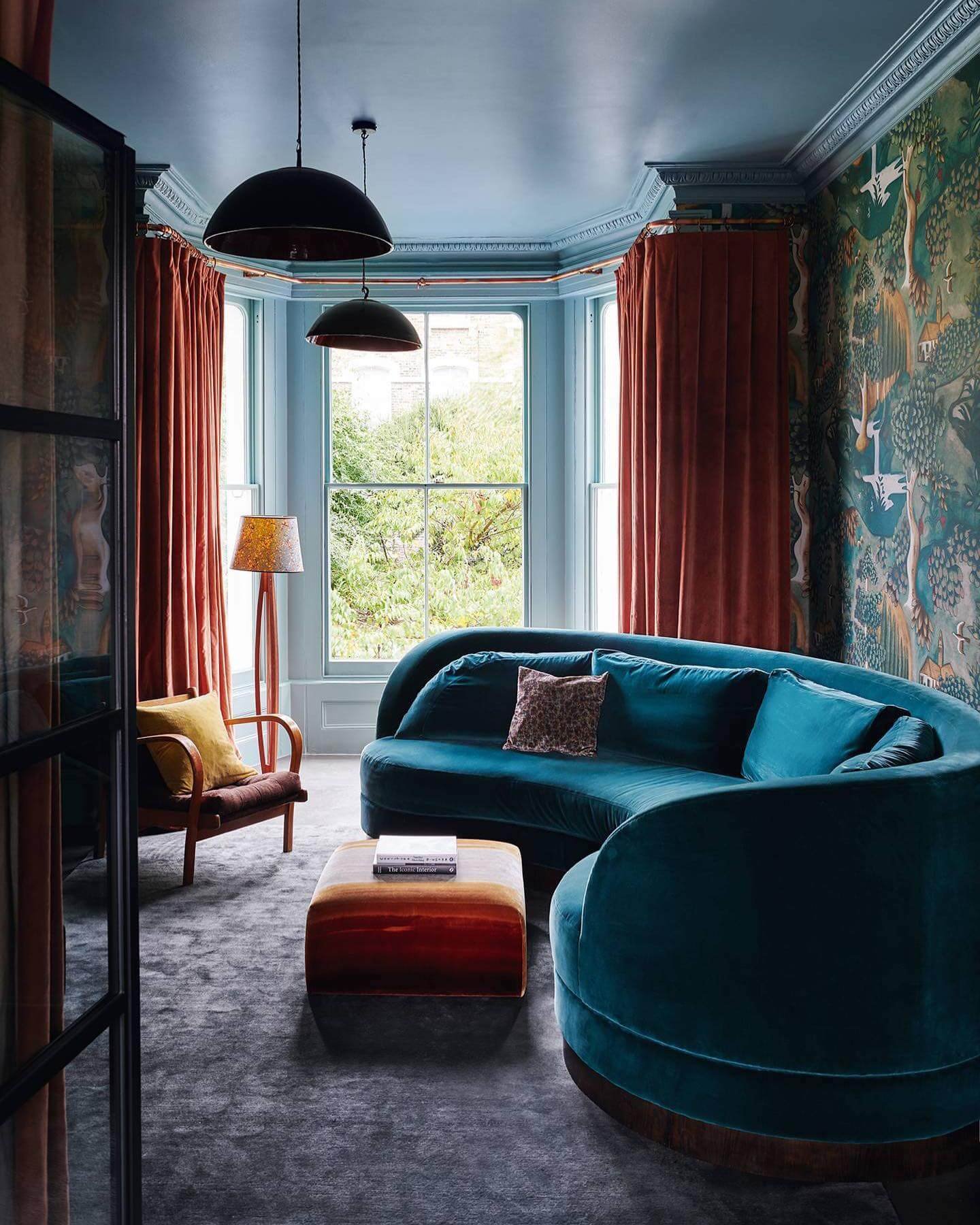 Velvet Seating and Bold Color Contrasts Moody Living Room