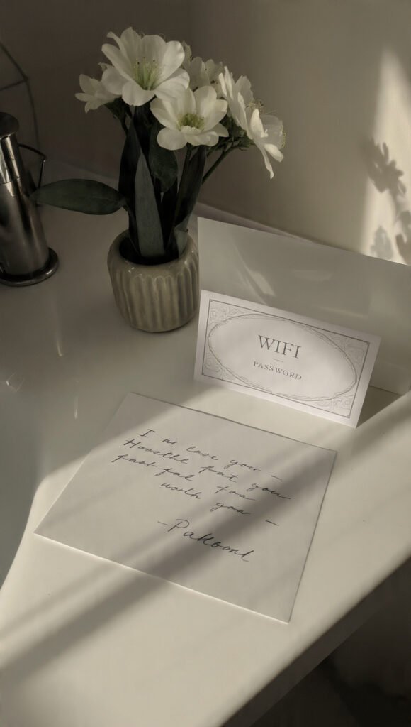 bathroom counter with handwritten welcome note card