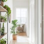 # Narrow Hallway Decorating Ideas That Add Style Without Bulk Your narrow hallway feels cramped and boring with white walls doing nothing. Adding decor seems risky—everything you try makes the tight space feel even smaller. You're stuck between leaving it plain or risking making it worse. Narrow hallway decorating works when choices enhance rather than crowd tight spaces. I'm covering 10 strategic approaches from minimalist wall art and slim console tables to mirror tricks and lighting upgrades. You'll see what actually fits narrow passages, how to decorate without blocking traffic, and designs making small hallways feel intentional. ## Smart Decorating For Tight Spaces **Slim Profiles Prevent Obstruction:** Narrow furniture and flat wall decor add style without consuming precious passage width. Shallow pieces maintain traffic flow while ending boring emptiness. **Vertical Focus Draws Eyes Up:** Tall elements and upward design pull attention from narrow width toward height. Vertical emphasis makes spaces feel less tunnel-like and constrained. **Light Colors Expand Perception:** Pale neutrals and whites reflect light making narrow spaces feel more open. Strategic color use optically widens tight hallways significantly. **Strategic Mirrors Multiply Space:** Reflective surfaces create depth illusion making hallways appear wider than reality. Mirror placement transforms perceived dimensions without construction. ## Narrow Hallway Decorating Ideas That Add Style Without Bulk Create stylish passages with these narrow hallway decorating ideas featuring space-smart solutions. ### Gallery Wall Single Line Arrange framed art in single horizontal line down one wall creating visual interest without bulk. The linear arrangement guides eyes along hallway making length work. It's like museum walls where art defines space. Use matching frames in black or white. Space pieces evenly creating rhythm. This narrow hallway decorating idea adds personality through flat wall application. ### Slim Console Table Add ultra-narrow console table (8-10 inches deep maximum) providing surface for keys and decor. The minimal depth adds function without blocking passage. It's like shelves with legs where slim wins. Choose wall-mounted or very slim freestanding options. Style minimally with lamp and small tray. This narrow hallway decorating idea adds utility carefully. ### Wall-Mounted Hooks Install decorative hooks creating functional art while organizing coats and bags. The vertical storage uses walls efficiently without floor space. It's like pegboards refined where hooks become design. Choose stylish brass, ceramic, or wood hooks. Space along wall length. This narrow hallway decorating idea combines beauty with practical storage. ### Runner Rug Only Layer patterned runner rug adding warmth and color through floor rather than walls. The textile softens hard surfaces without width consumption. It's like pathways where runners define routes. Choose patterns with lengthwise direction. Keep proportions leaving floor visible on sides. This narrow hallway decorating idea adds comfort without crowding. ### Minimalist Sconces Mount slim wall sconces providing ambient lighting and architectural interest. The flat fixtures add design without protruding dangerously into passages. It's like jewelry where minimal adds maximum. Use modern linear designs or classic small sconces. Install at regular intervals. This narrow hallway decorating idea improves lighting and style simultaneously. ### Vertical Striped Wallpaper Apply vertical striped wallpaper making ceilings appear higher drawing focus upward. The pattern direction counteracts narrowness through height emphasis. It's like pinstripes where lines create illusion. Choose subtle tone-on-tone or bolder contrasts. Run from floor to ceiling. This narrow hallway decorating idea visually expands through pattern. ### Large Mirror Statement Hang one oversized mirror creating focal point and reflecting light throughout space. The single large piece makes bigger impact than multiple small items. It's like windows where reflection opens walls. Position opposite light sources or at hallway end. Use substantial frame making statement. This narrow hallway decorating idea doubles perceived space optically. ### Floating Shelves Minimal Install 6-8 inch deep floating shelves displaying small items without blocking passage. The shallow depth provides function while maintaining clearance. It's like ledges where depth stays controlled. Style with small plants, candles, or framed photos. Keep quantities minimal. This narrow hallway decorating idea adds personality through restrained display. ### Painted Accent Ceiling Paint ceiling different color drawing attention upward away from narrow walls. The unexpected color application adds interest through fifth wall. It's like sky where overhead becomes feature. Use soft colors or dramatic darks depending on style. The ceiling focus reduces tunnel feeling. This narrow hallway decorating idea shifts perception creatively. ### Baseboard And Trim Upgrade Enhance existing trim with paint or replace with more substantial molding adding architectural detail. The refined details elevate plain passages through subtle enhancement. It's like framing where edges matter. Paint trim contrasting with walls or same color for subtle sophistication. The detail upgrade costs little but delivers impact. This narrow hallway decorating idea improves through refinement. ## Common Narrow Hallway Decorating Mistakes And Solutions ### Adding Bulky Furniture Standard-depth console tables or chairs narrow already tight passages creating obstacles. Solution: Use only furniture under 10 inches deep or wall-mounted pieces maintaining minimum 36-inch clearance. ### Overcrowding Walls Too many frames, shelves, or decor creates visual chaos making spaces feel cluttered. Solution: Choose few larger pieces rather than masses of small items maintaining breathing room. ### Using Dark Heavy Colors Dark paint makes narrow spaces feel more confined and cave-like reducing natural light. Solution: Stick with whites, creams, and light neutrals reflecting light and expanding perception. ### Hanging Items At Wrong Heights Art too high or too low looks awkward and wastes visual impact opportunity. Solution: Center artwork at 57-60 inches from floor matching standard gallery height. ### Blocking Natural Light Placing items near windows or light sources reduces brightness making hallways darker. Solution: Keep areas near light sources clear allowing maximum illumination spreading throughout space. ## Frequently Asked Questions About Narrow Hallway Decorating ### What's The Best Color For Narrow Hallways? White and soft creams work best reflecting maximum light making narrow spaces feel most open. Light grays and pale beiges also expand perception while adding subtle warmth. Avoid dark colors making spaces feel smaller and cave-like. Consider semi-gloss or satin finishes reflecting more light than flat paint. Consistent color throughout avoids breaking space into smaller segments. ### How Wide Should Hallway Console Tables Be? Maximum 10 inches deep for narrow hallways under 42 inches wide maintaining comfortable passage. Ideally 8 inches or less prevents obstruction while providing functional surface. Measure hallway width ensuring adequate clearance remains. Wall-mounted floating options eliminate legs creating cleaner appearance. Some hallways too narrow for any console requiring alternative solutions. ### Can You Wallpaper Narrow Hallways? Yes—wallpaper adds pattern and interest to plain walls effectively. Choose vertical patterns or subtle overall designs avoiding horizontal emphasis making spaces feel shorter. Large-scale patterns work better than tiny busy prints. Consider accent wall at hallway end rather than all walls preventing overwhelming small spaces. Removable wallpaper offers commitment-free testing. ## Styling Your Narrow Hallway Successfully Narrow hallway decorating ideas prove tight passages can have personality without feeling cramped. Choose slim furniture and flat wall decor maintaining traffic flow, use light colors expanding perceived width, and decorate selectively avoiding clutter. Keep pieces under 10 inches deep and maintain clean passage clearance. narrow hallway decorating ideas